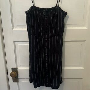 Black and white striped mini dress. Slight sweetheart neckline. Size women’s L.